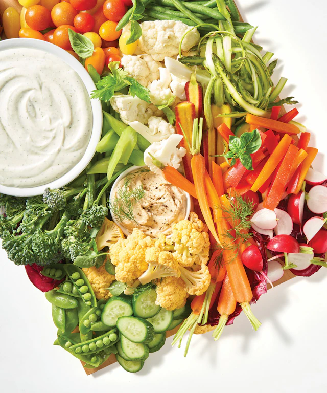 A brightly colored veggie platter of various types of vegetables.