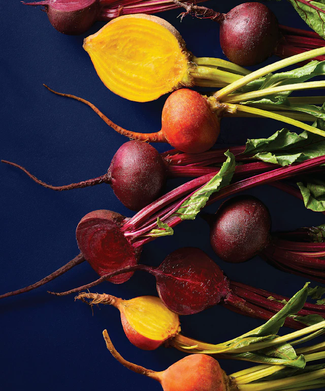 Assorted beets on a blue background