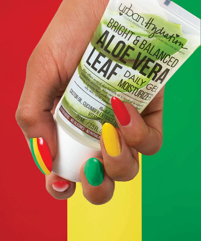 A hand holding a lotion bottle