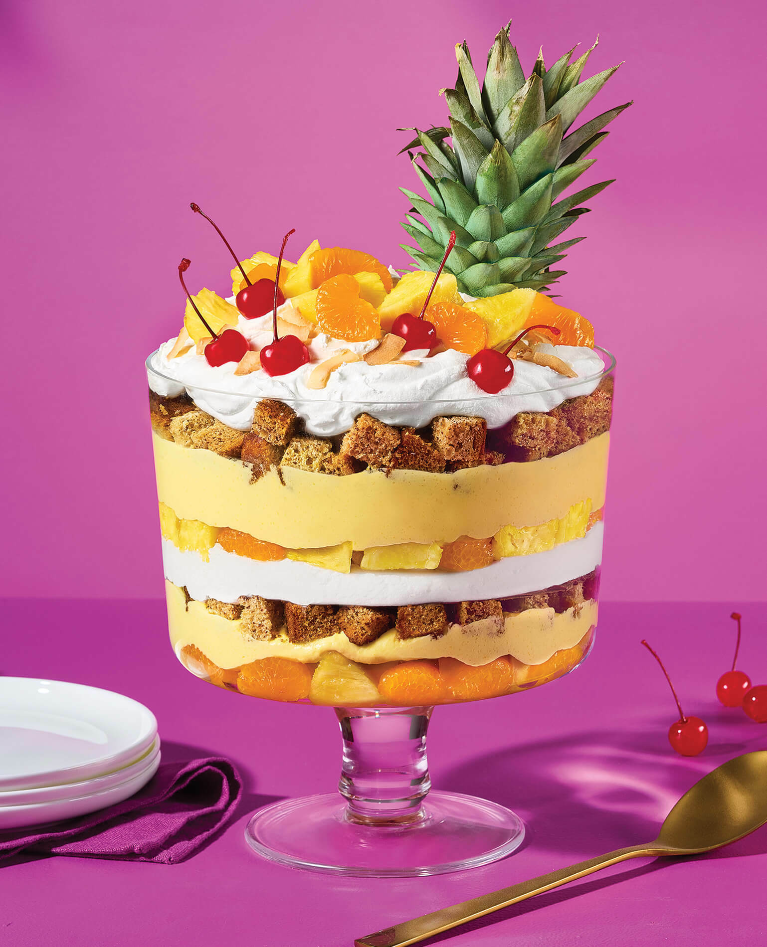 A tropical stacked trifle on a purple background.