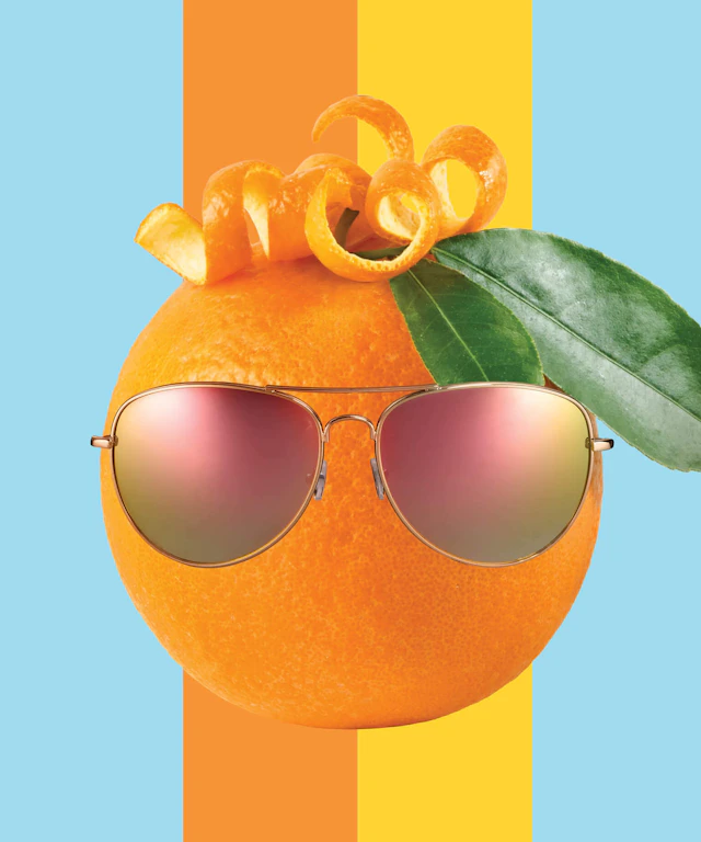An orange with sunglasses on to mimic the look of a person.