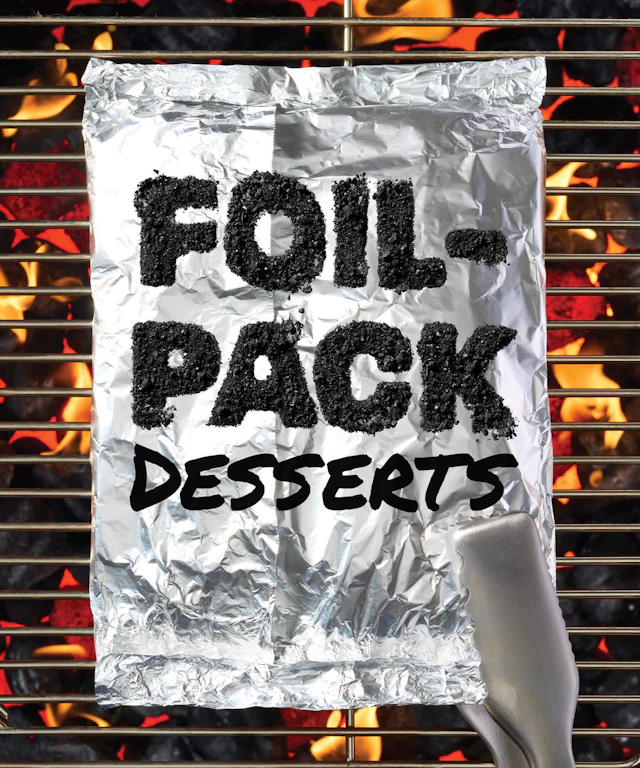 A foil pack on a grill engulfed in flames.