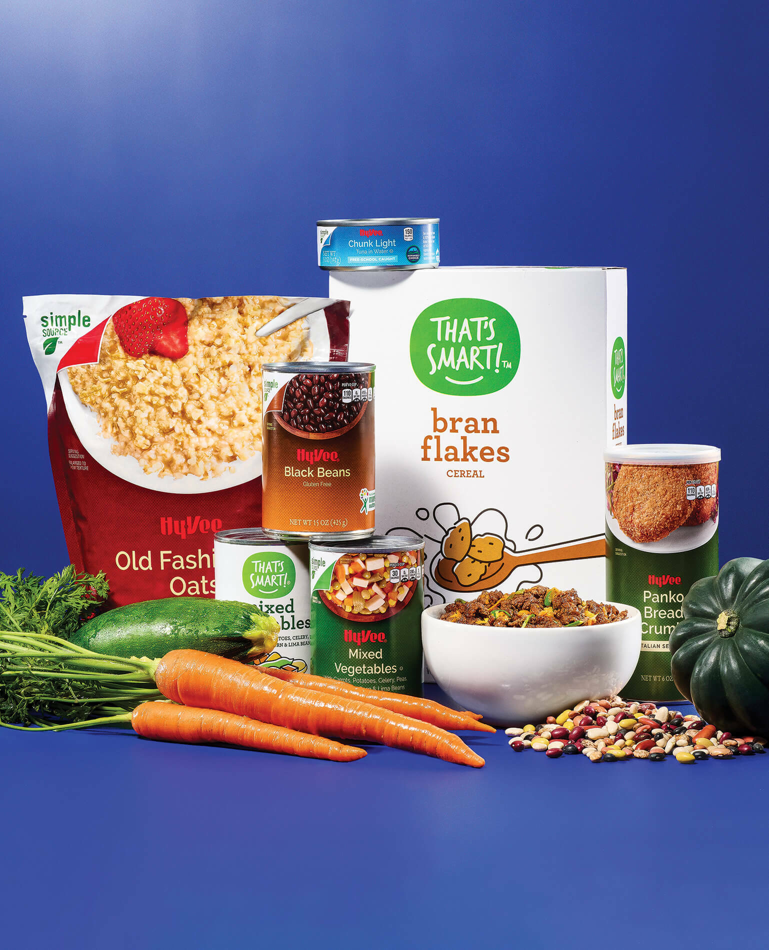 A series of budget friendly grocery items on a blue background.