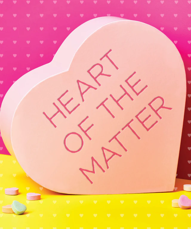 A candy heart with the words "heart of the matter" inscribed