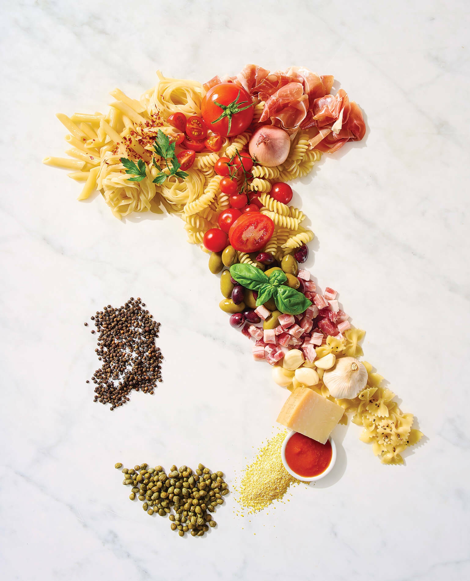 Foods of Italy put together to form the shape of the country of Italy.