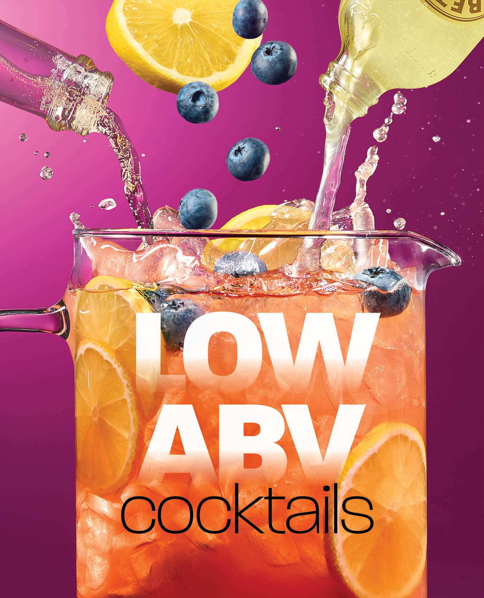 Low alcohol drinks and fruit being poured into a pitcher.