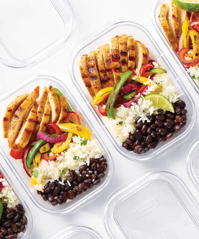 A row of Tupperware containers all filled with the same foods for a weekly meal prep.
