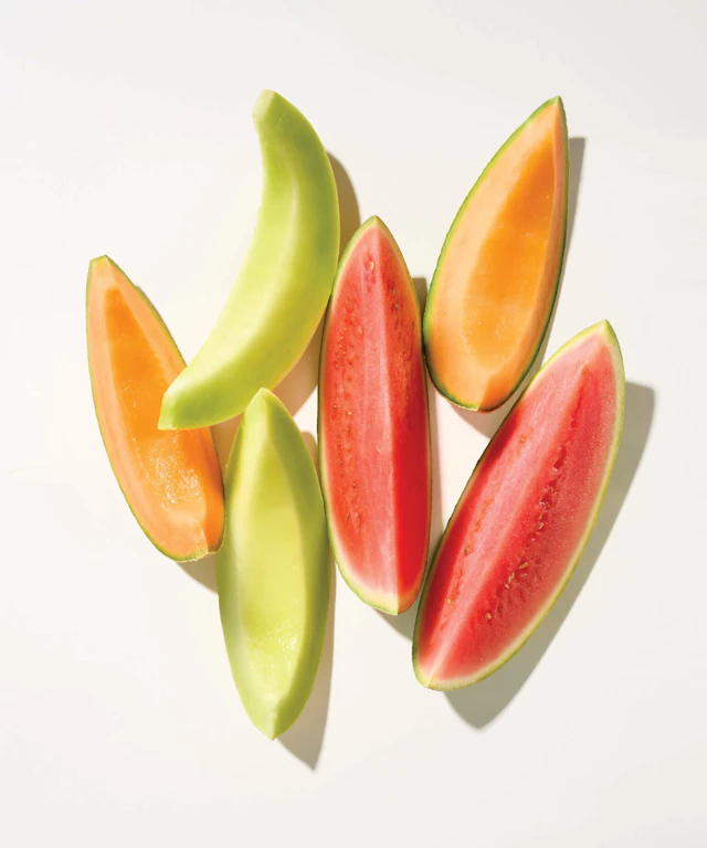 A few slices of various melons: watermelon, cantaloupe, and honeydew.