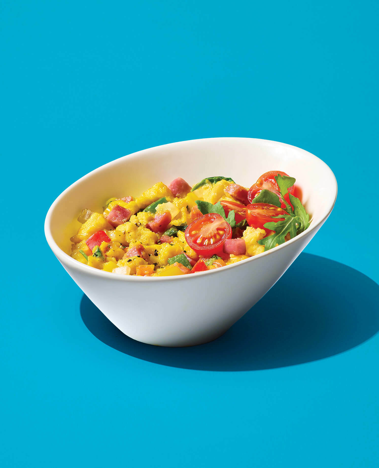 A bowl of egg scramble made in the microwave.