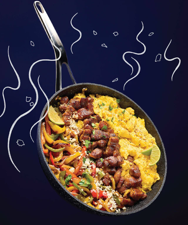 A steaming skillet of eggs and other breakfast delights