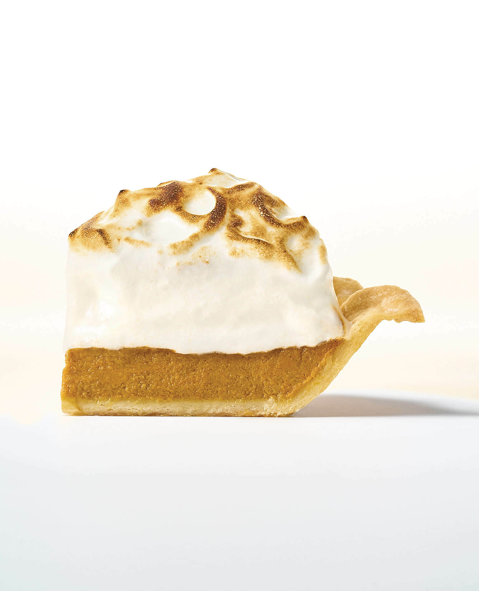 A single slice of pumpkin pie.