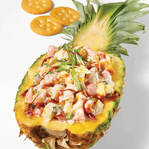 Creamy Pineapple Shrimp Dip served in a carved out pineapple