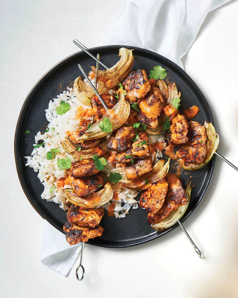 Plate of Butter Chicken Kabobs served over rice