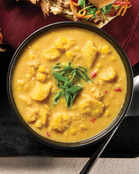 Bowl of Thai Corn Chowder with a spoon