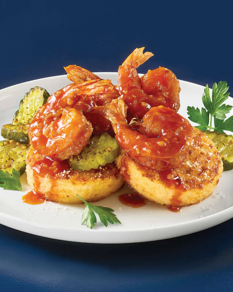 A plate of Spicy Fried Nashville Shrimp and Grits