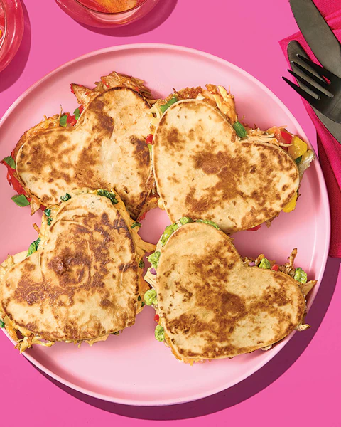 A plate of heart-shaped quesadillas