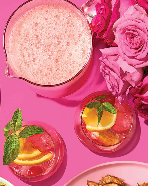 A pitcher and two glasses of Love Potion Punch