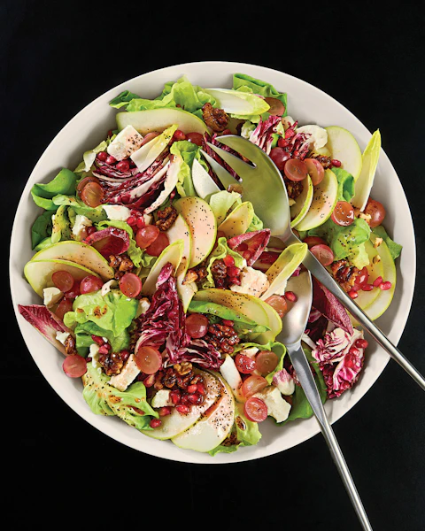 A serving bowl of Pear and Goat Cheese Salad