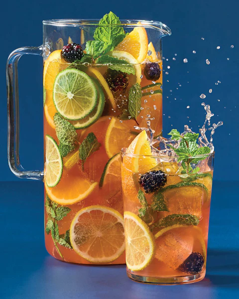 A pitcher and glass of Radler Berry Beer Punch