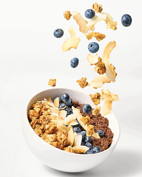 A bowl of Chocolatey Granola Topped Oatmeal with Blueberries