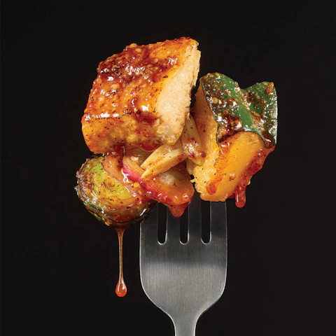 Forkful of Hot Maple Mustard Chicken with Roasted Vegetables