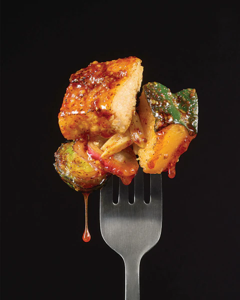 Forkful of Hot Maple Mustard Chicken with Roasted Vegetables
