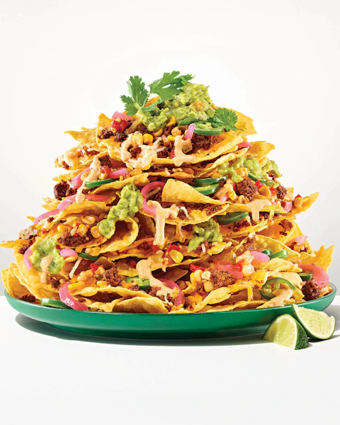 Plate stacked with Vegan Sheet Pan Nachos