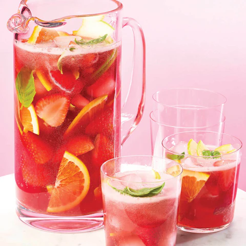 Pitcher and two glasses of Hibiscus Kombucha Sangria Punch
