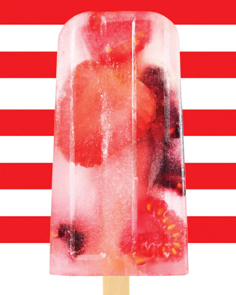 A Coconut Berry Hydration Pop on a red and white striped background.