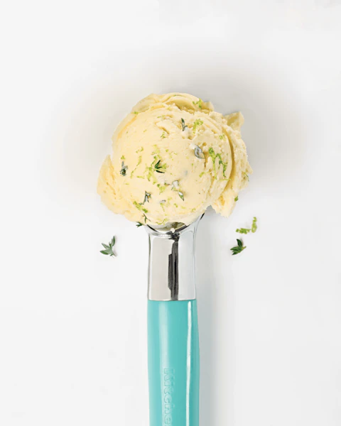 A single scoop of No Churn Lime Thyme Ice Cream