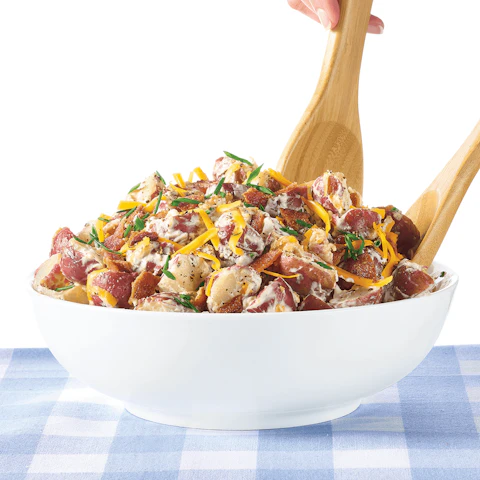 Bowl of Loaded Potato Salad being served