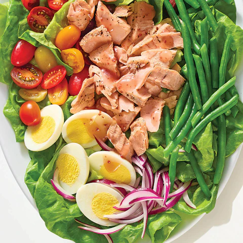 A serving platter of Microwaved Salmon Nicoise Salad.