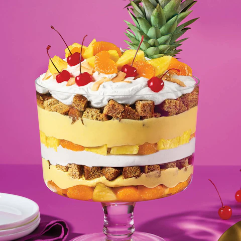 Serving bowl of a layered Tropical Pina Colada Trifle dessert.