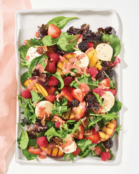 Serving platter of Berry n Peach Kale Salad