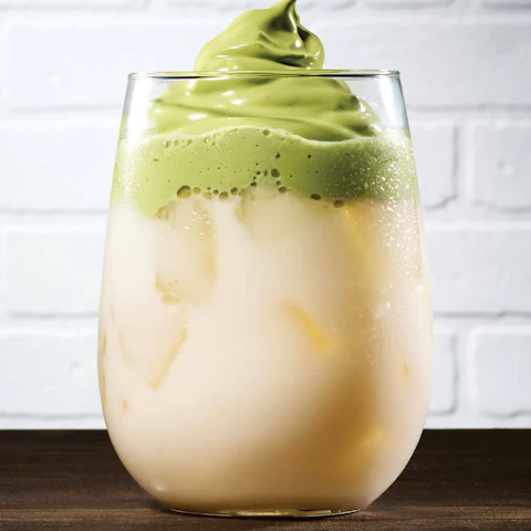 A glass of Matcha Dalgona Latte.
