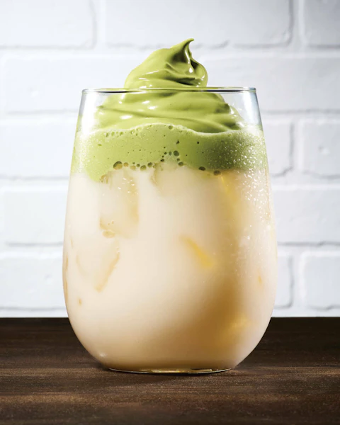 A glass of Matcha Dalgona Latte.