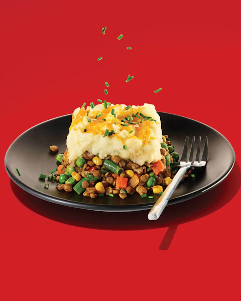 A slice of Vegetarian Shepards Pie on a plate.