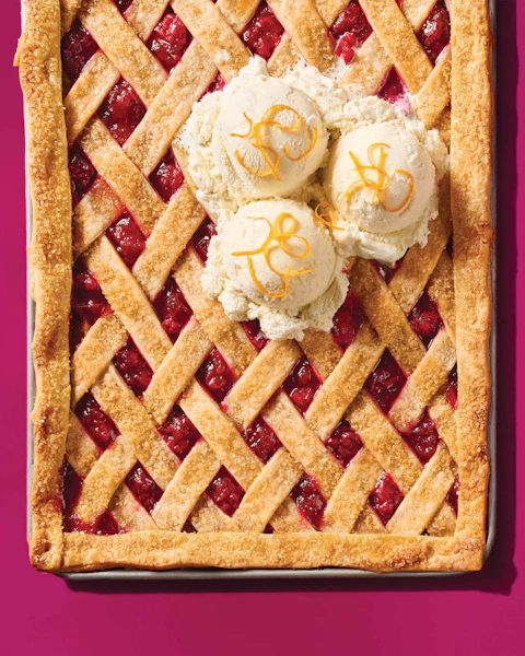 Baking sheet of Cranberry Citrus Slab Pie topped with ice cream