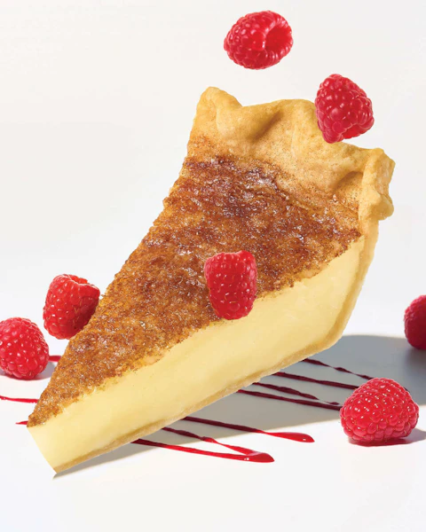 A slice of Retro Sugar Pie with raspberries
