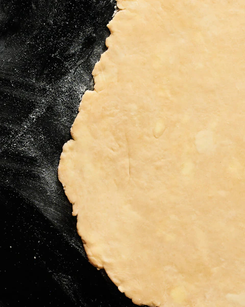 Single Crust Pie Pastry rolled out onto a flour covered slab