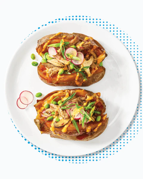 Plate of two Korean Pulled Pork Stuffed Sweet Potato halves