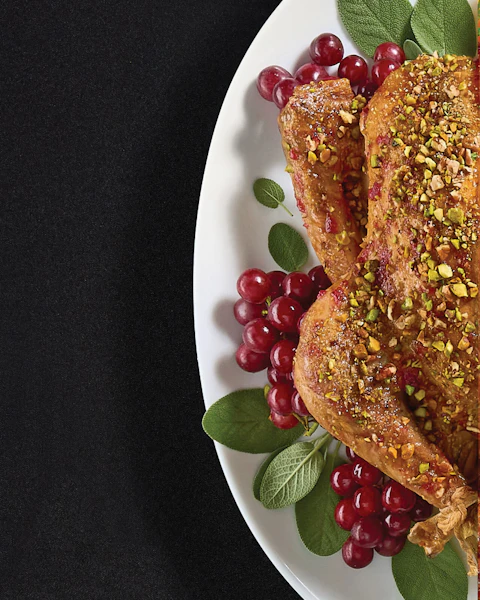 Serving platter of Roasted Turkey with Cranberry Thyme Glaze