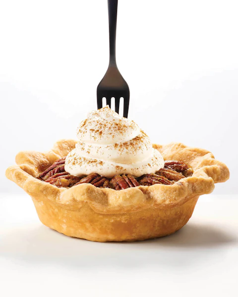 A fork poking into a Mini Southern Pecan Pie