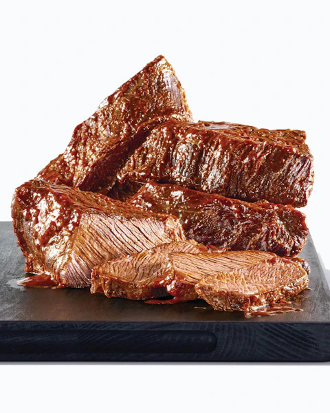 Slices of Instant Pot Chuck Roast stacked
