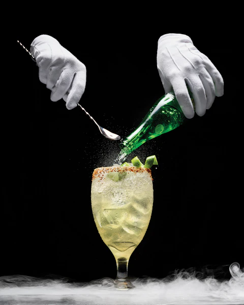 Two gloved hands mixing Tequila Ranch Water cocktails