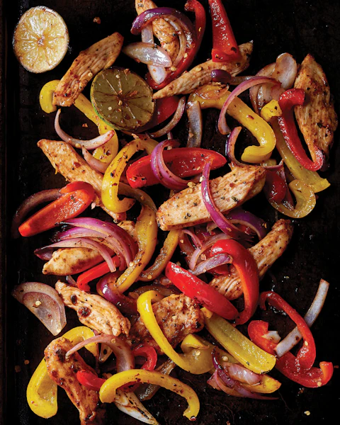 Sheet Pan Chicken Fajitas ingredients: chicken, onions and peppers.