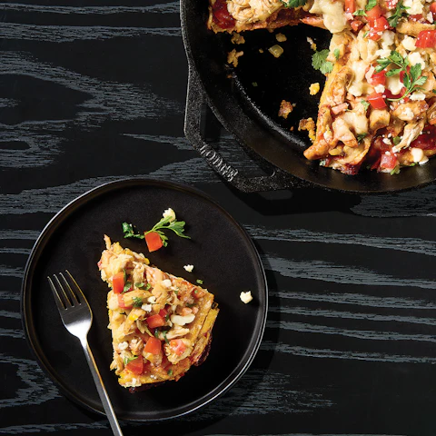 A skillet and a plate of One Pan Chicken Tamale Pie