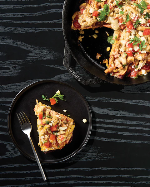 A skillet and a plate of One Pan Chicken Tamale Pie