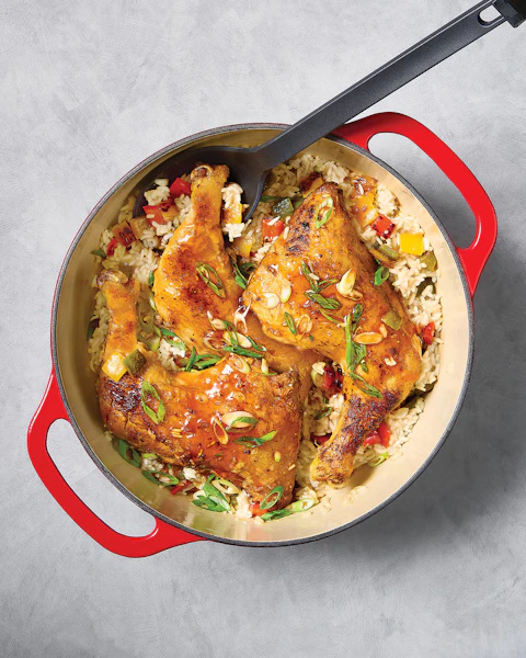 One Pan Hot Honey Chicken being scooped by a serving spoon.