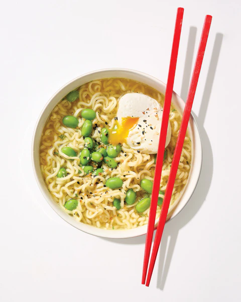 A bowl of Everything Bagel Ramen with Poached Egg with chopsticks